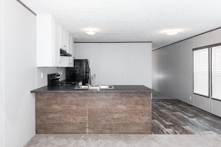 The BLAZER 76 4A Dining Area. This Manufactured Mobile Home features 4 bedrooms and 2 baths.