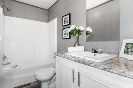 The THE MORRIS Guest Bathroom. This Manufactured Mobile Home features 3 bedrooms and 2 baths.