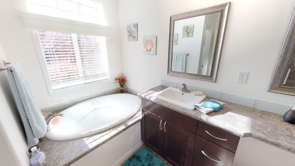 The SUM3068A Primary Bathroom. This Manufactured Mobile Home features 3 bedrooms and 2 baths.
