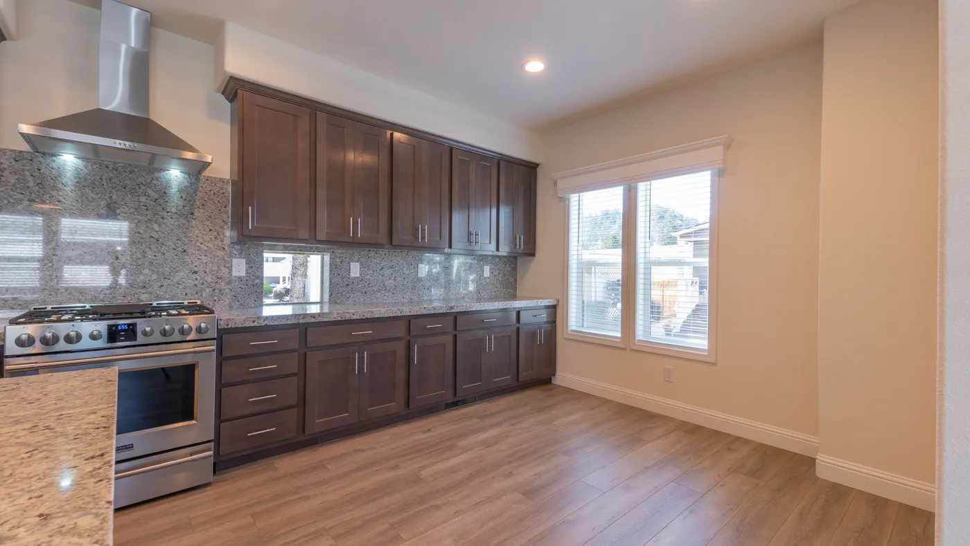 The CORONADO 2456B Kitchen. This Manufactured Mobile Home features 3 bedrooms and 2 baths.