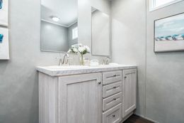 The ULTRA BREEZE 76 Guest Bathroom. This Manufactured Mobile Home features 4 bedrooms and 2 baths.