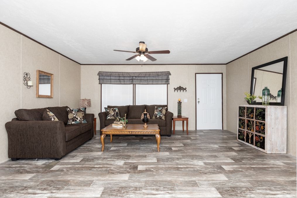 The THE RIVERWAY Living Room. This Manufactured Mobile Home features 4 bedrooms and 2 baths.