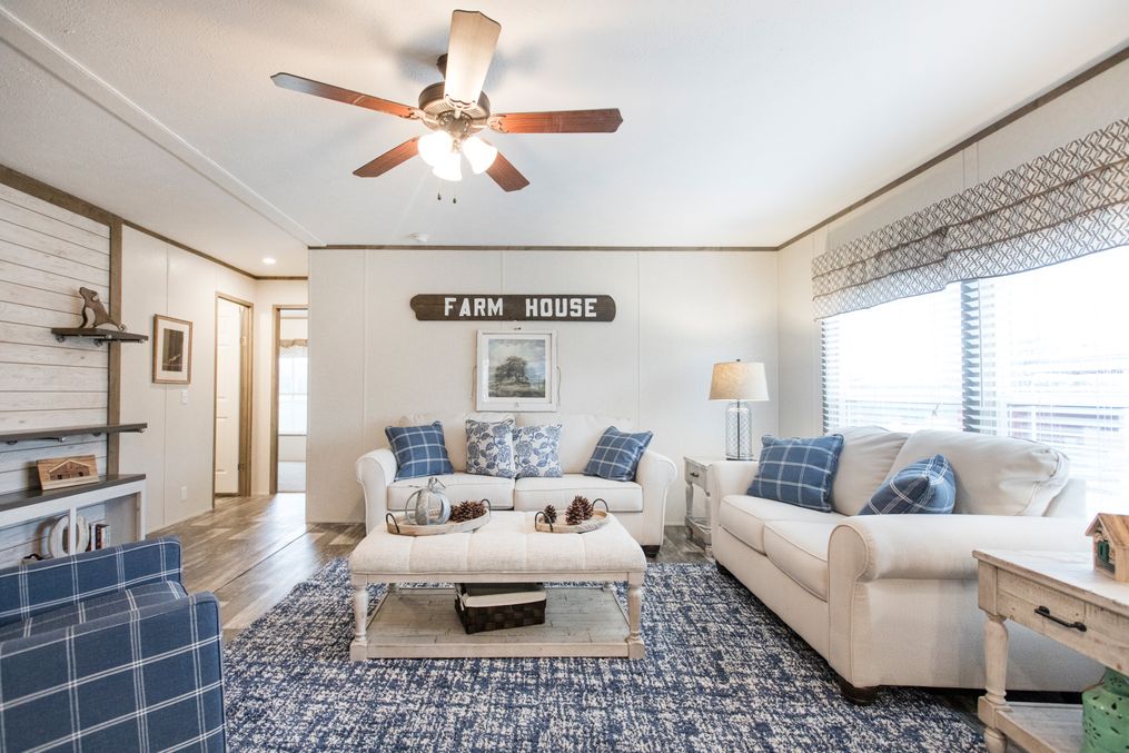 The THE SOUTHERN FARMHOUSE Living Room. This Manufactured Mobile Home features 3 bedrooms and 2 baths.