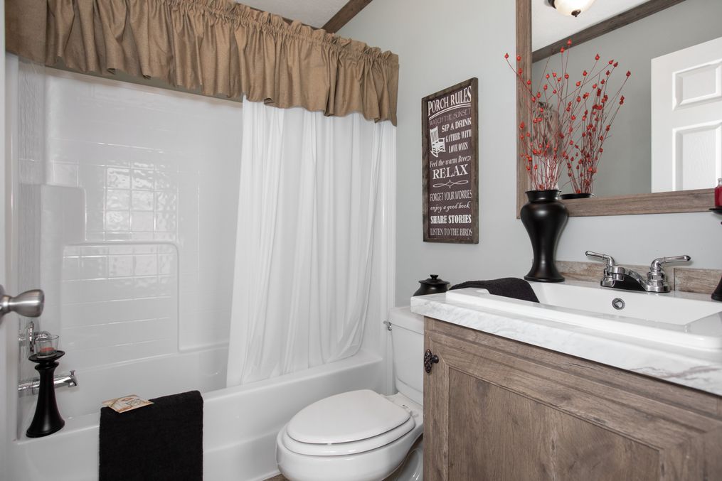 The THE MARION Guest Bathroom. This Manufactured Mobile Home features 3 bedrooms and 2 baths.