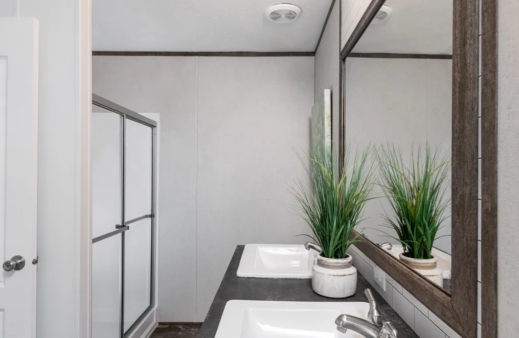 The THE SOCIAL 76 Primary Bathroom. This Manufactured Mobile Home features 3 bedrooms and 2 baths.