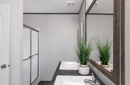 The THE SOCIAL 76 Master Bathroom. This Manufactured Mobile Home features 3 bedrooms and 2 baths.