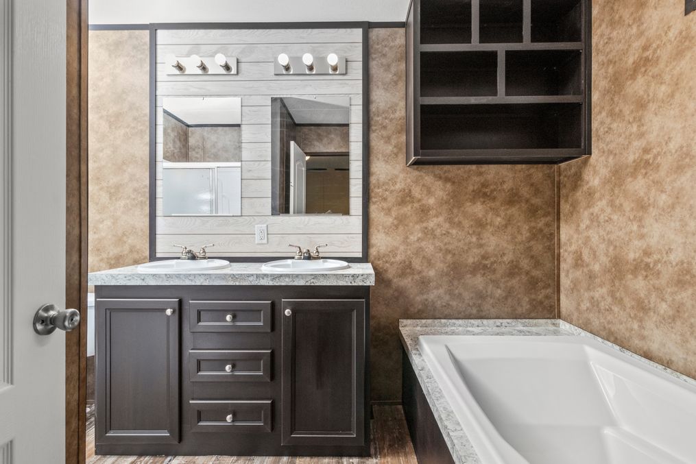 The THE ANNIVERSARY ISLANDER Master Bathroom. This Manufactured Mobile Home features 3 bedrooms and 2 baths.