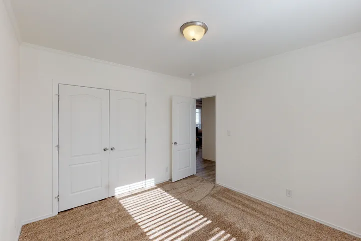 The SUM3068A Bedroom. This Manufactured Mobile Home features 3 bedrooms and 2 baths.