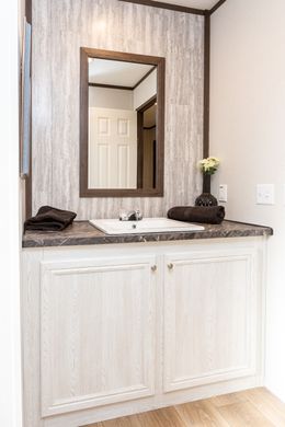 The THE HAMPTON BAY Guest Bathroom. This Manufactured Mobile Home features 3 bedrooms and 2 baths.