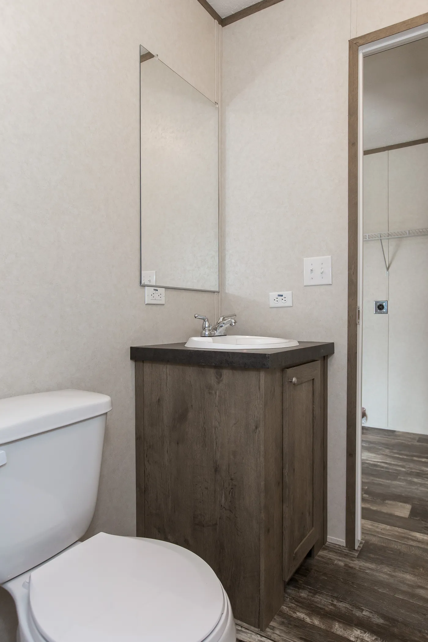 The THE BREEZE Guest Bathroom. This Manufactured Mobile Home features 3 bedrooms and 2 baths.
