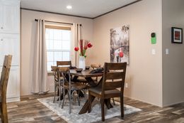 The ULTRO PRO HERCULES Dining Area. This Manufactured Mobile Home features 3 bedrooms and 2 baths.