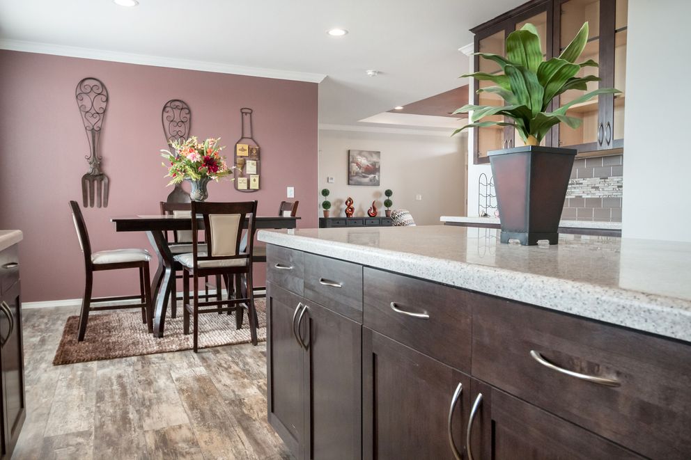 The ENCHANTMENT 3070A Kitchen. This Manufactured Mobile Home features 3 bedrooms and 2 baths.