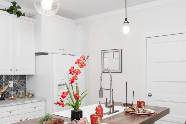 The 1439 CAROLINA "MAGNOLIA" Kitchen. This Manufactured Mobile Home features 3 bedrooms and 2 baths.