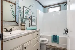 The THE EMMA JEAN Guest Bathroom. This Manufactured Mobile Home features 4 bedrooms and 3 baths.