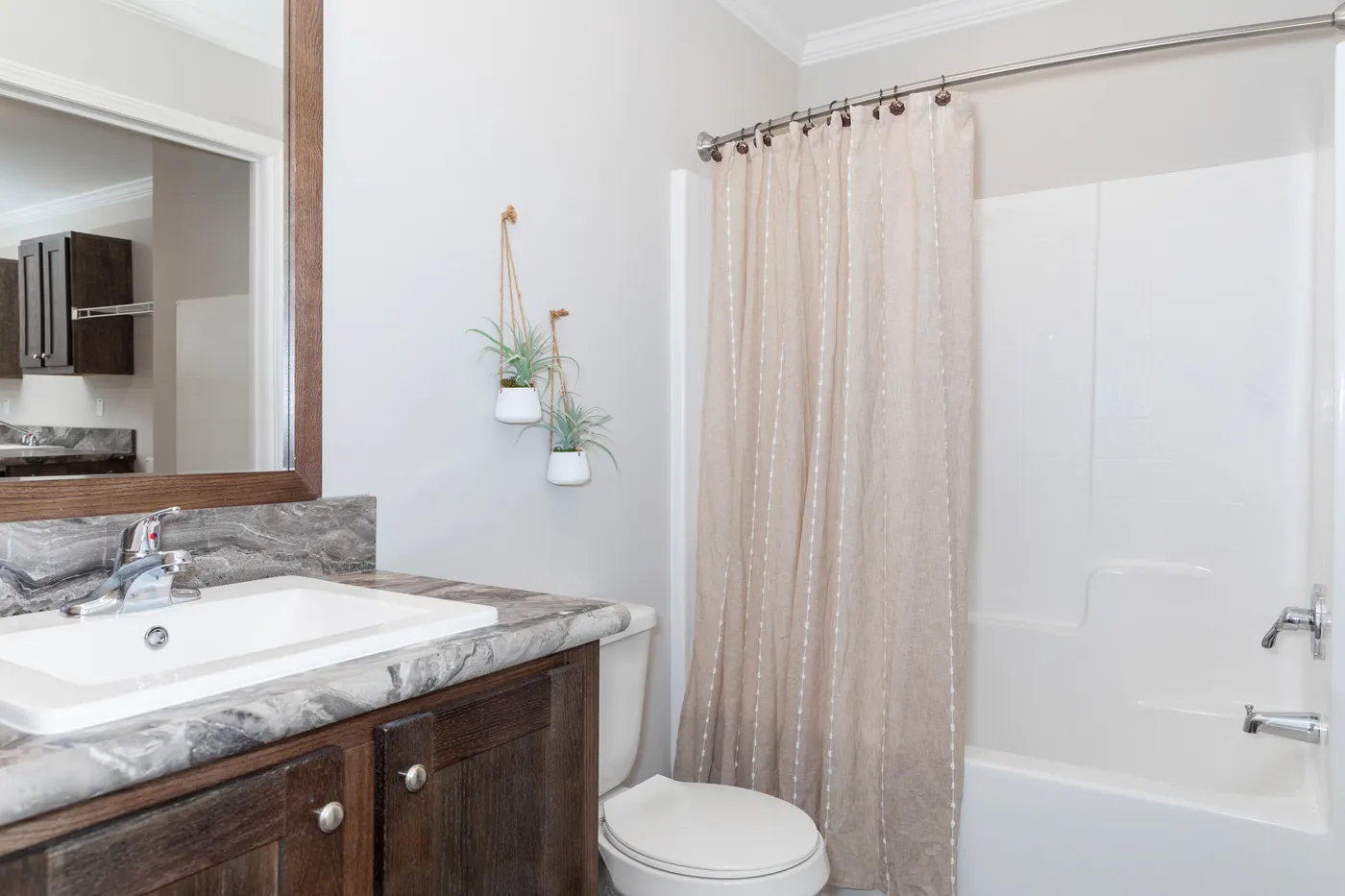 The THE VILLETTE Guest Bathroom. This Manufactured Mobile Home features 3 bedrooms and 2 baths.
