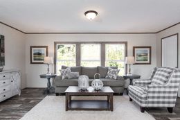The THE BREEZE II Living Room. This Manufactured Mobile Home features 4 bedrooms and 2 baths.
