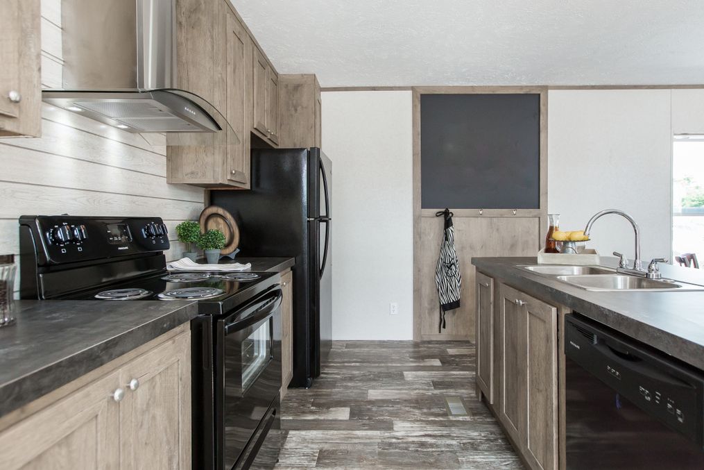 The THE BREEZE Kitchen. This Manufactured Mobile Home features 3 bedrooms and 2 baths.