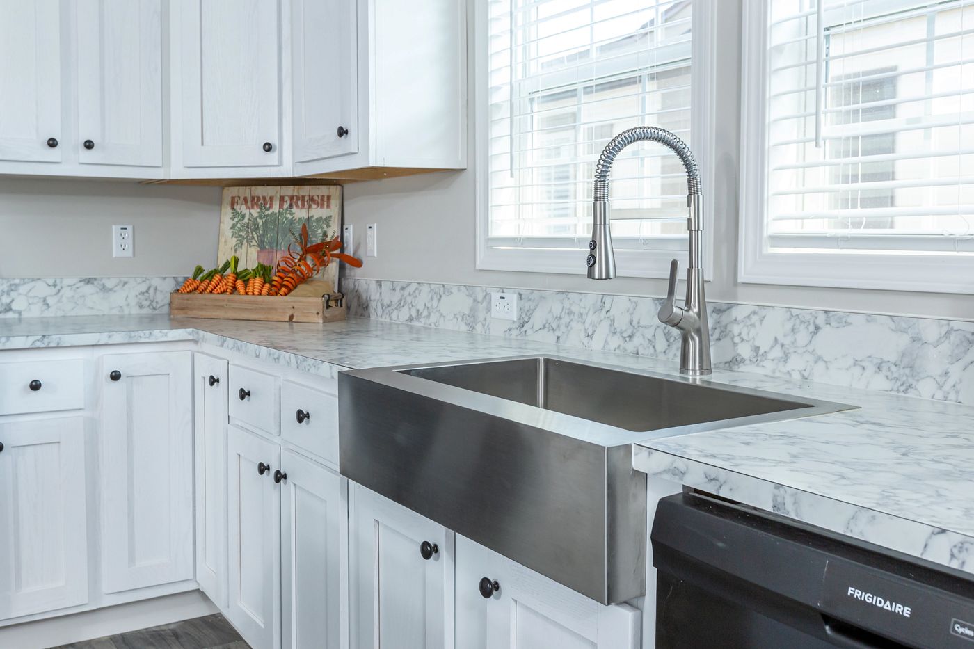The THE FREEDOM BREEZE Kitchen. This Manufactured Mobile Home features 3 bedrooms and 2 baths.