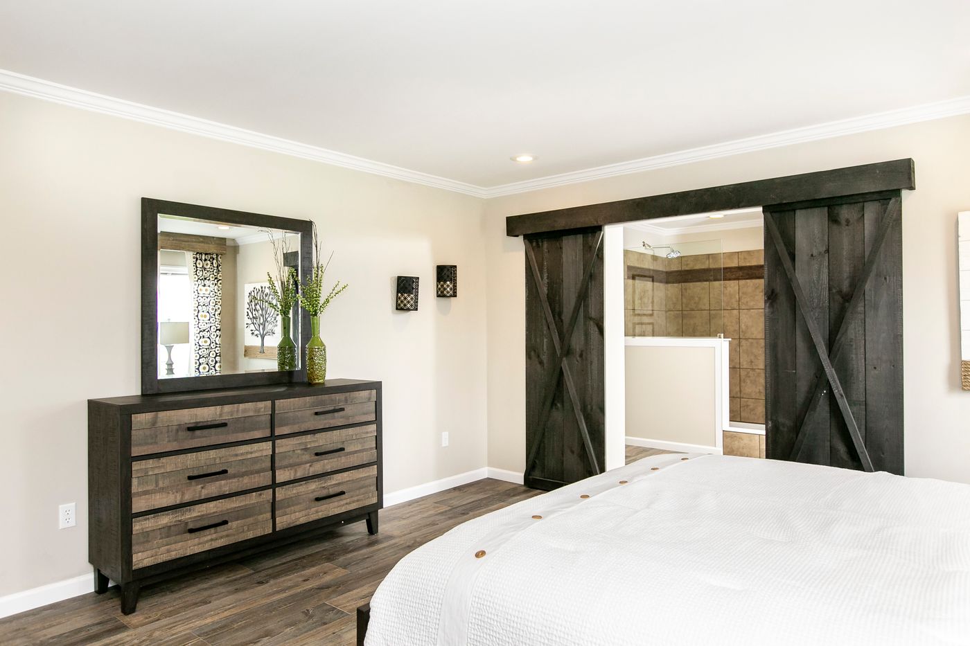 The FREEDOM FARM HOUSE  32X60 Primary Bedroom. This Manufactured Mobile Home features 3 bedrooms and 2 baths.