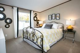 The TRIUMPH Guest Bedroom. This Manufactured Mobile Home features 5 bedrooms and 3 baths.