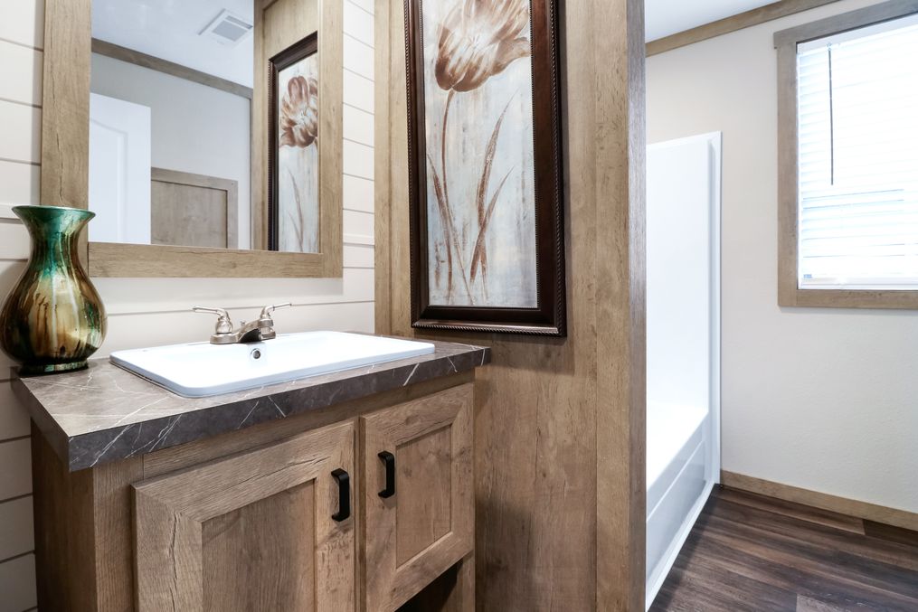 The AMELIA Guest Bathroom. This Manufactured Mobile Home features 4 bedrooms and 2 baths.