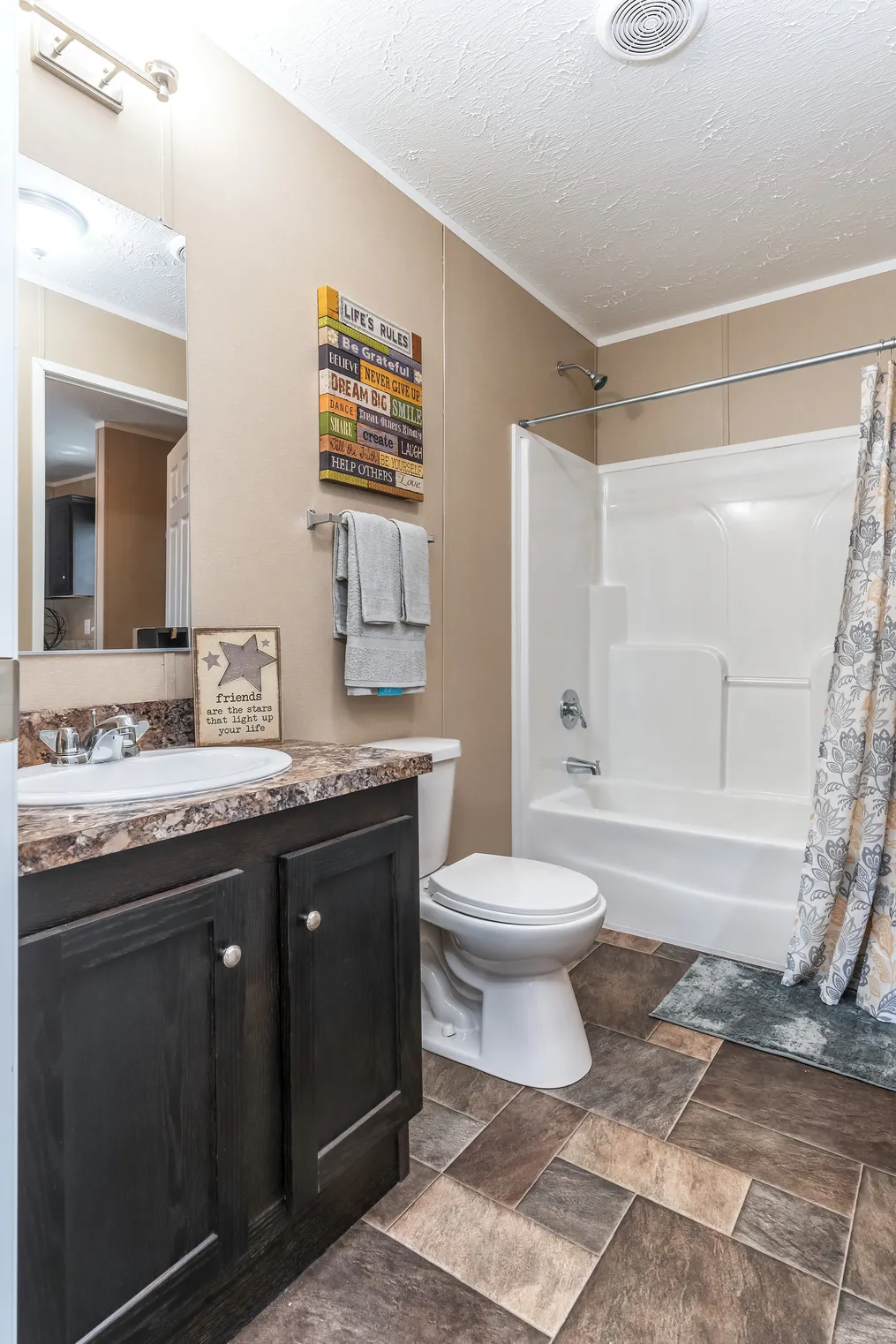 The 5604 ENTERPRISE 4 6428 Guest Bathroom. This Manufactured Mobile Home features 3 bedrooms and 2 baths.
