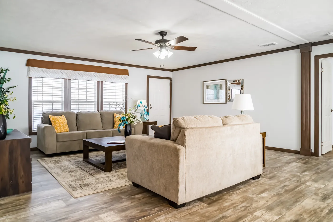 The THE TURNER Living Room. This Manufactured Mobile Home features 3 bedrooms and 2 baths.