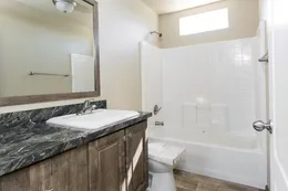 The 2022 COLUMBIA RIVER Guest Bathroom. This Manufactured Mobile Home features 3 bedrooms and 2 baths.