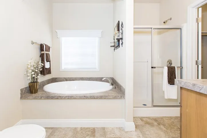 The K1676H Primary Bathroom. This Manufactured Mobile Home features 3 bedrooms and 2 baths.
