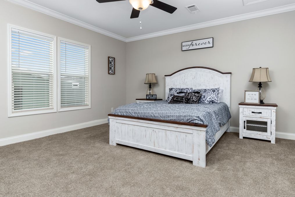 The THE YUKON Master Bedroom. This Manufactured Mobile Home features 4 bedrooms and 3 baths.