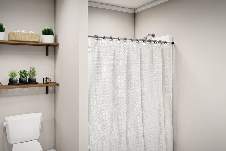The THE VALHALLA Guest Bathroom. This Manufactured Mobile Home features 3 bedrooms and 2 baths.