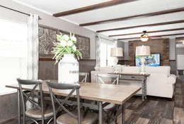 The TRADITION 76C Dining Area. This Manufactured Mobile Home features 4 bedrooms and 2 baths.