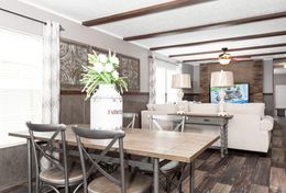 The TRADITION 76C Dining Area. This Manufactured Mobile Home features 4 bedrooms and 2 baths.