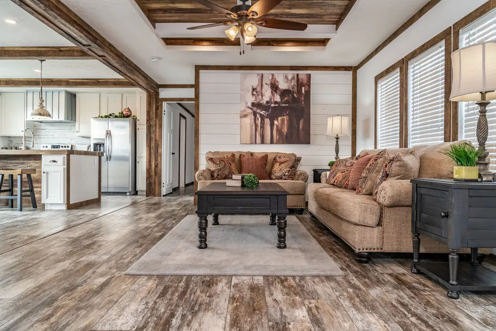 The THE AVALYN Living Room. This Manufactured Mobile Home features 3 bedrooms and 2 baths.