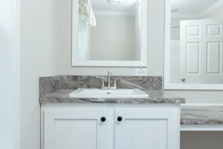 The THE FREEDOM BREEZE Guest Bathroom. This Manufactured Mobile Home features 3 bedrooms and 2 baths.