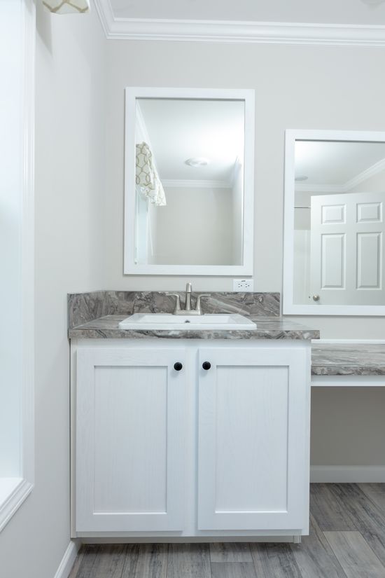 The THE FREEDOM BREEZE Guest Bathroom. This Manufactured Mobile Home features 3 bedrooms and 2 baths.