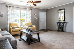 The TRADITION 2868B Living Room. This Manufactured Mobile Home features 4 bedrooms and 2 baths.