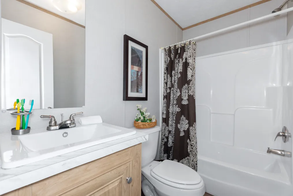The BLAZER 56 B Guest Bathroom. This Manufactured Mobile Home features 2 bedrooms and 2 baths.