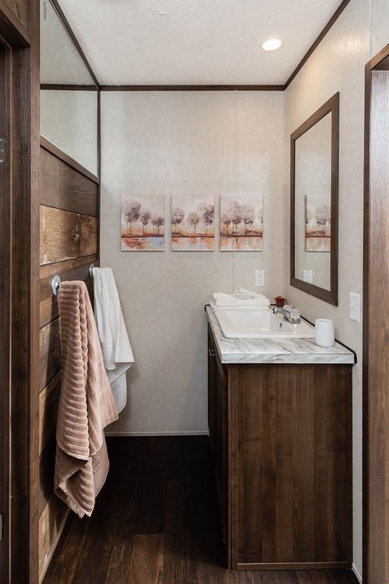 The THE STOCKTON Guest Bathroom. This Manufactured Mobile Home features 4 bedrooms and 3 baths.