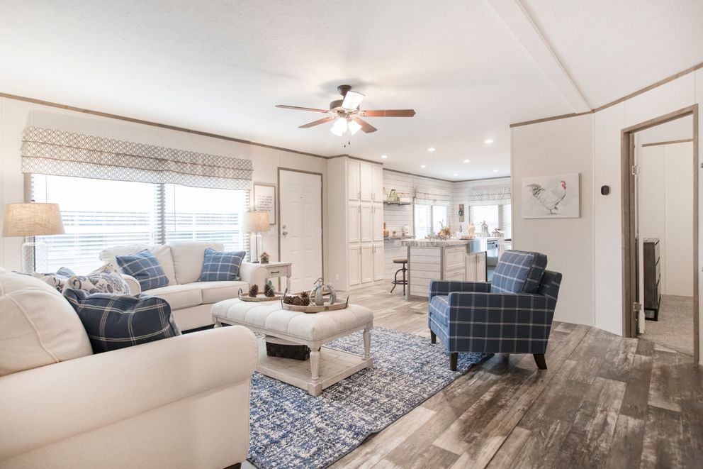 The THE SOUTHERN FARMHOUSE Living Room. This Manufactured Mobile Home features 3 bedrooms and 2 baths.