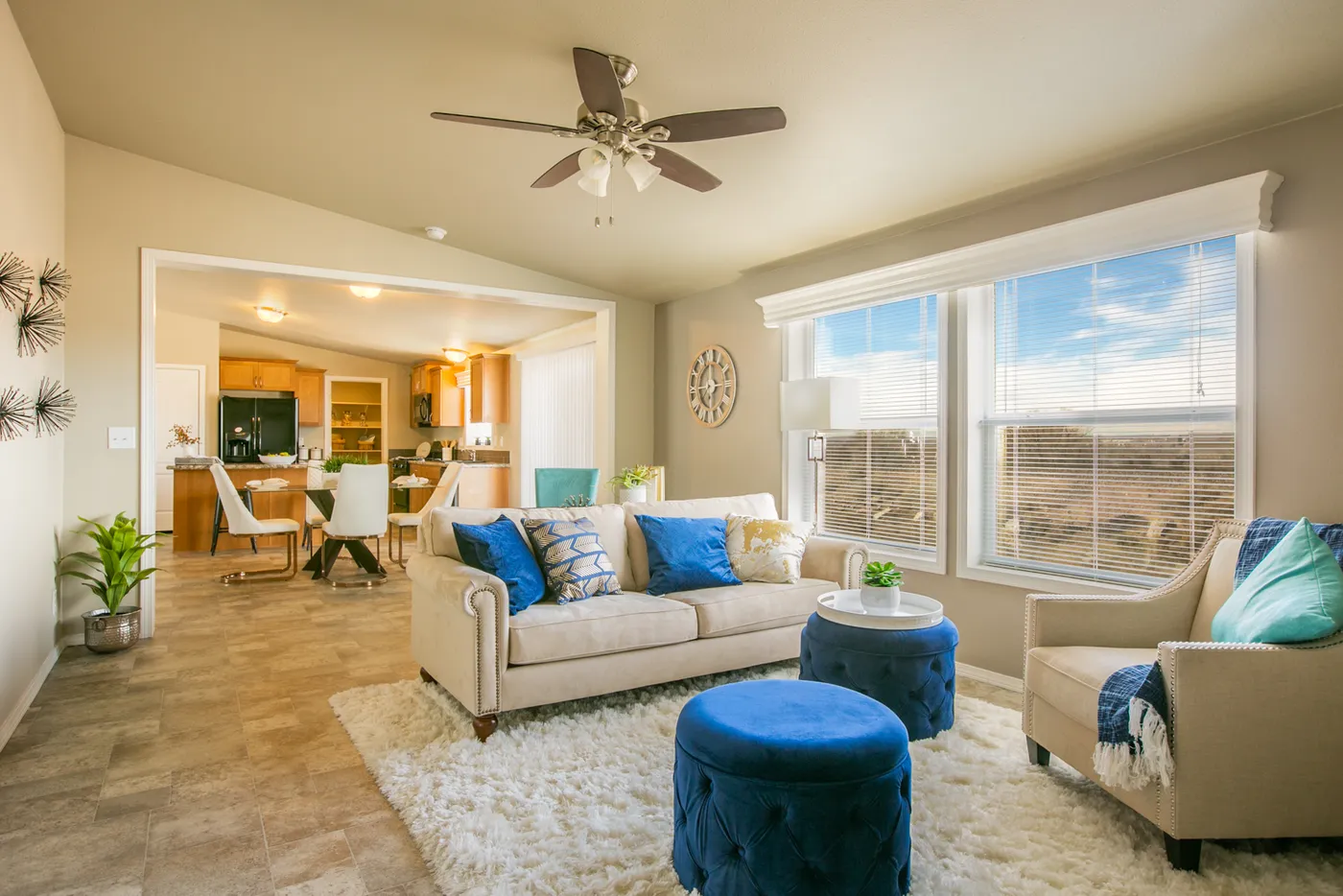 The THE WAVE Living Room. This Manufactured Mobile Home features 4 bedrooms and 2 baths.