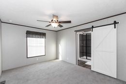 The THE REFLECTIONS Primary Bedroom. This Manufactured Mobile Home features 3 bedrooms and 2 baths.