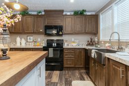 The BLACKJACK 32' Kitchen. This Manufactured Mobile Home features 4 bedrooms and 2 baths.