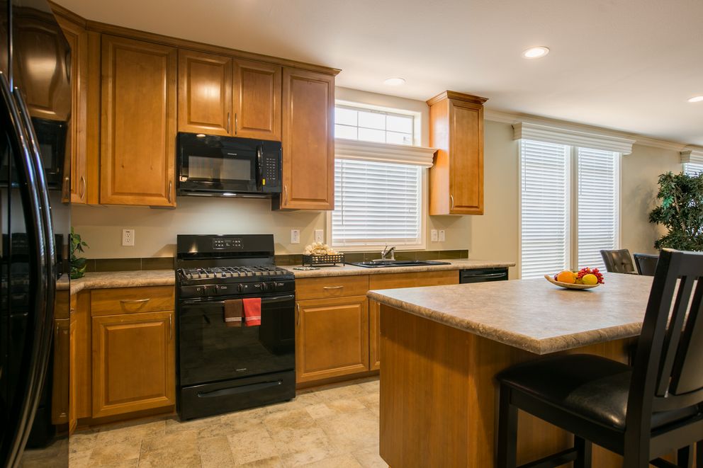 The TRANQUILITY TR3062A Kitchen. This Manufactured Mobile Home features 3 bedrooms and 2 baths.
