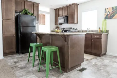 The FAIRPOINT 24463A Kitchen. This Manufactured Mobile Home features 3 bedrooms and 2 baths.