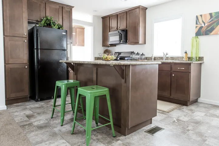 The FAIRPOINT 24463A Kitchen. This Manufactured Mobile Home features 3 bedrooms and 2 baths.