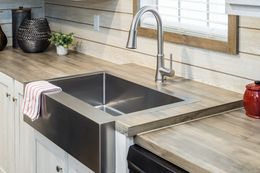 The ULTRO PRO HERCULES Kitchen. This Manufactured Mobile Home features 3 bedrooms and 2 baths.