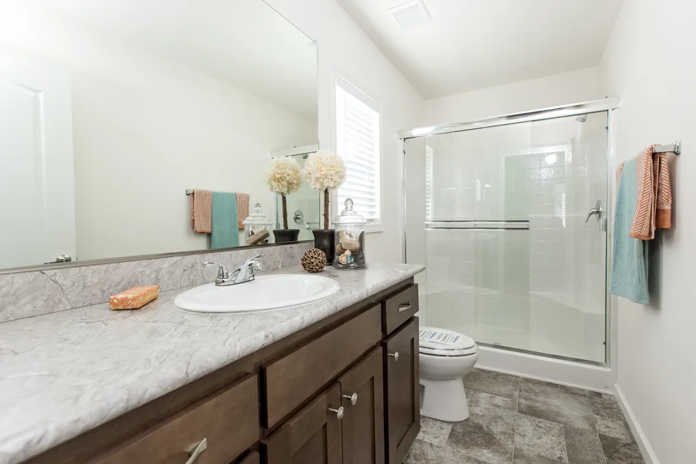 The FAIRPOINT 24463A Primary Bathroom. This Manufactured Mobile Home features 3 bedrooms and 2 baths.