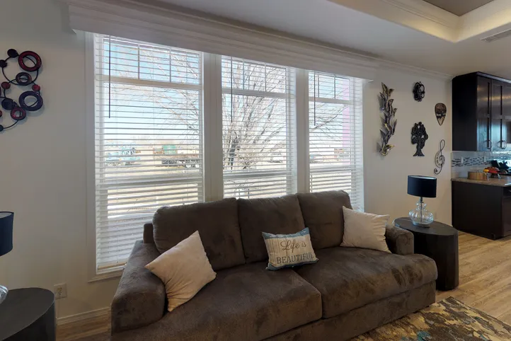 The SUM3068A Living Room. This Manufactured Mobile Home features 3 bedrooms and 2 baths.