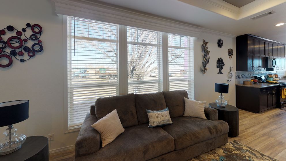 The SUM3068A Living Room. This Manufactured Mobile Home features 3 bedrooms and 2 baths.
